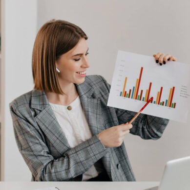 Businesswoman presenting a bar chart during a meeting
