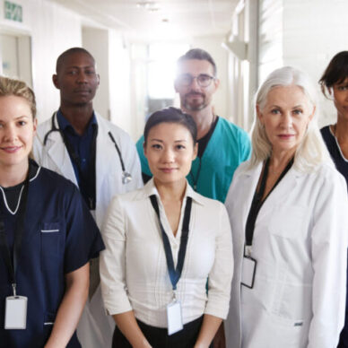 Portrait Of Medical Team Standing In Hospital Corridor Medical team standing together in a hospital corridor