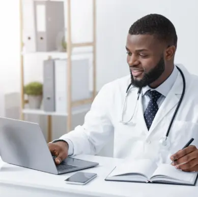 Friendly doctor conducting an online check-up via computer