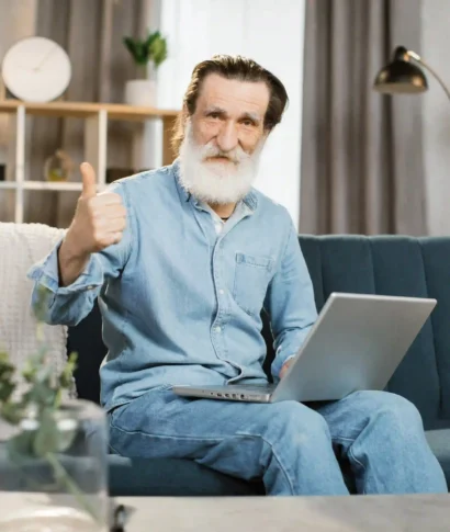 handsome-mature-gentleman-using-laptop-for-video-c-2024-12-13-13-56-22-utc (1)